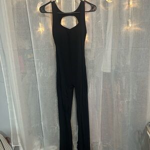 black athletic flared jumpsuit with cutouts